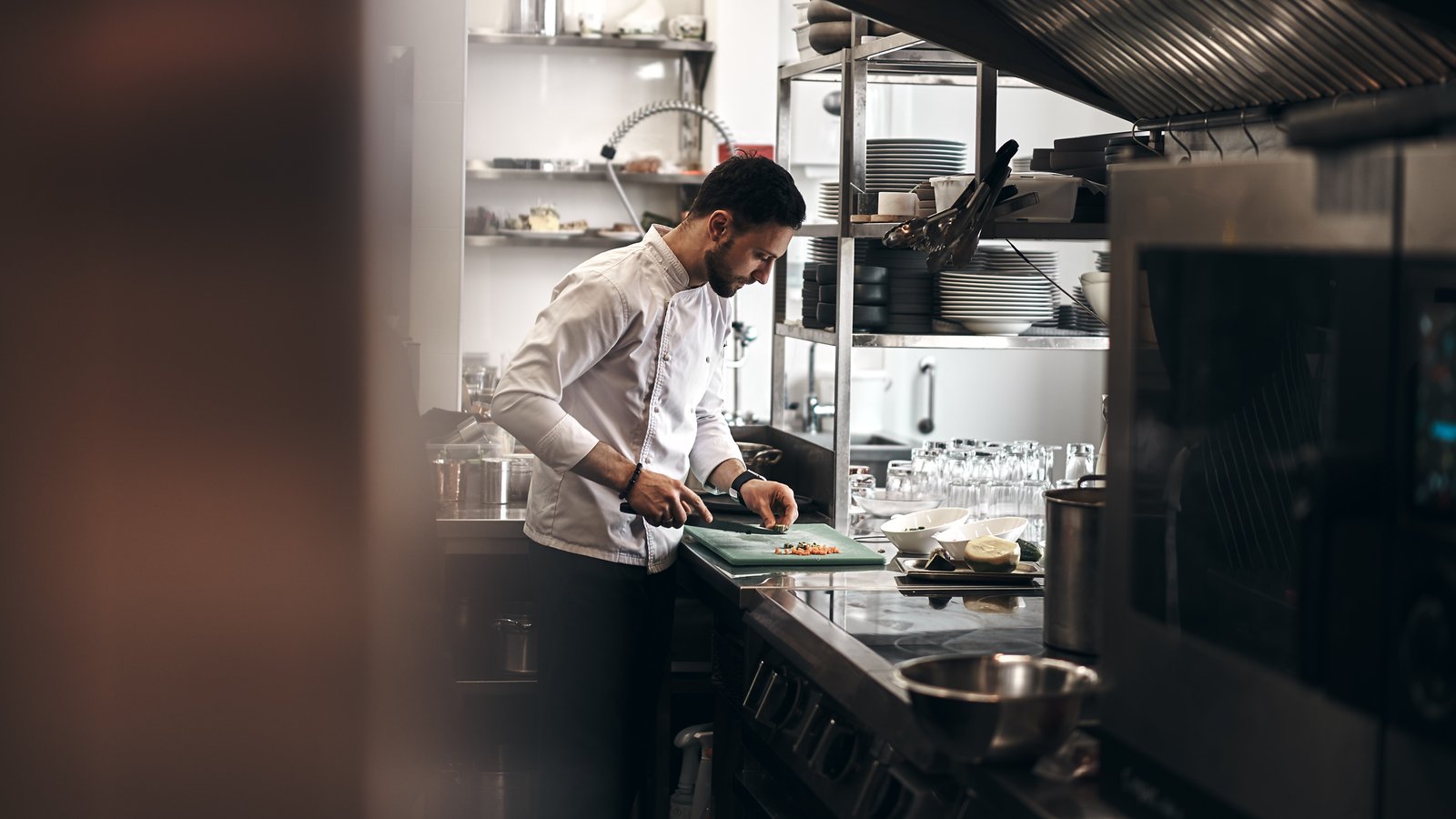Cutting vegetables by a cook